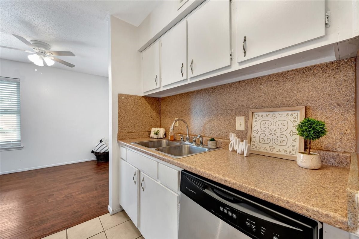 With a pantry and ample upper and lower cabinets, every inch of this kitchen is designed for convenience and functionality.