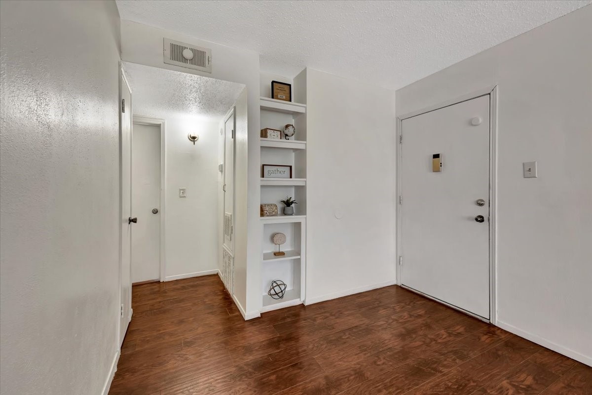 A closer look at the convenient shelving just to the left of the entryperfect for storing everyday essentials, decor, or keeping things organized as you come and go.