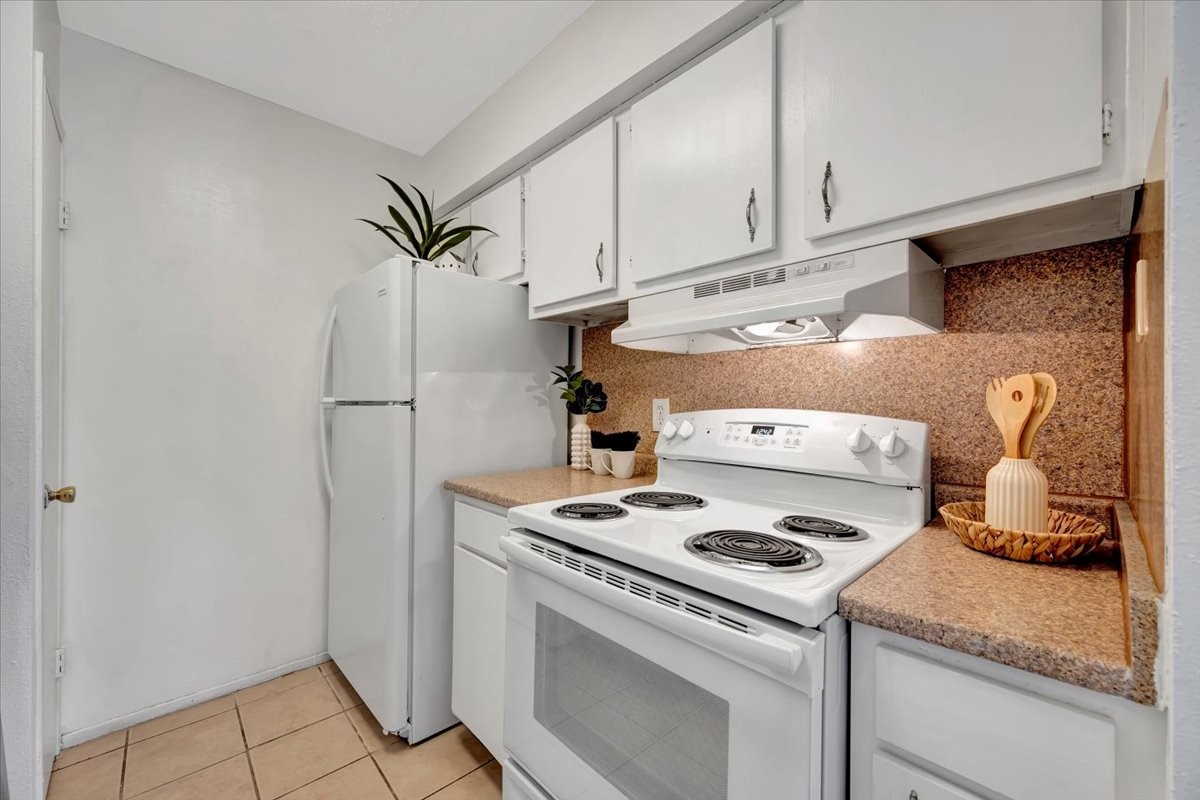 Compact yet well-equipped, this kitchen maximizes space with smart design and plenty of storage!