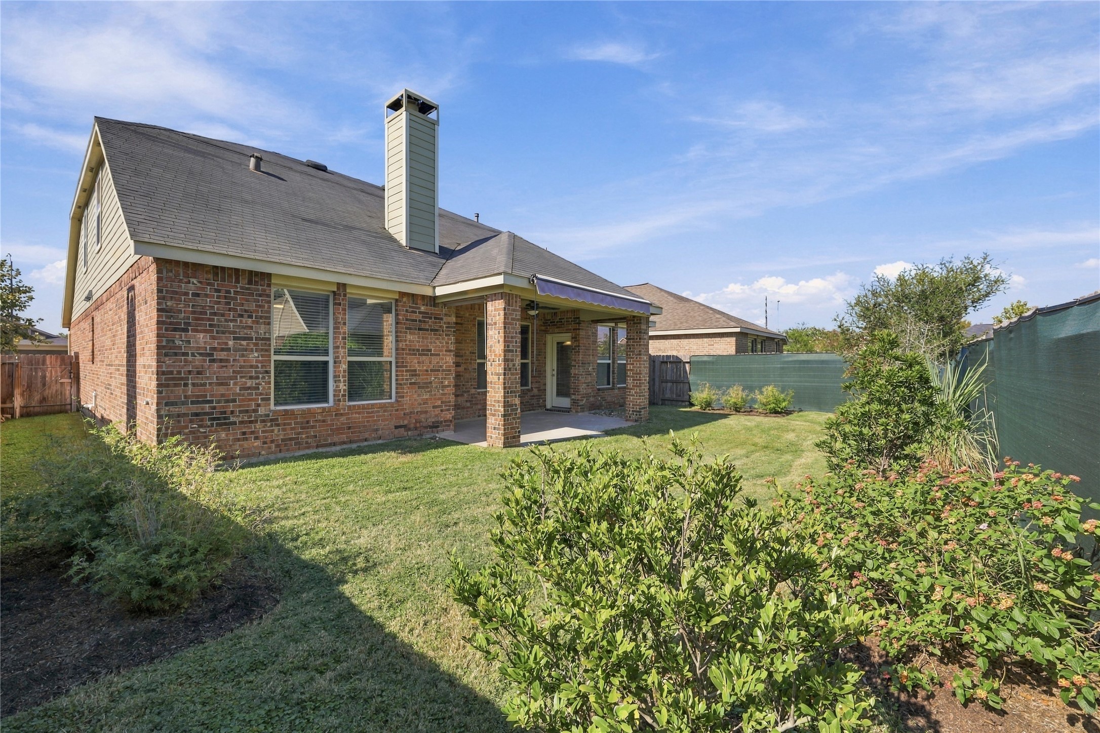 From the beautifully landscaped backyard to the inviting covered patio with retractable shade, this home offers the perfect setting to relax, entertain, and create lasting memories. Welcome home!