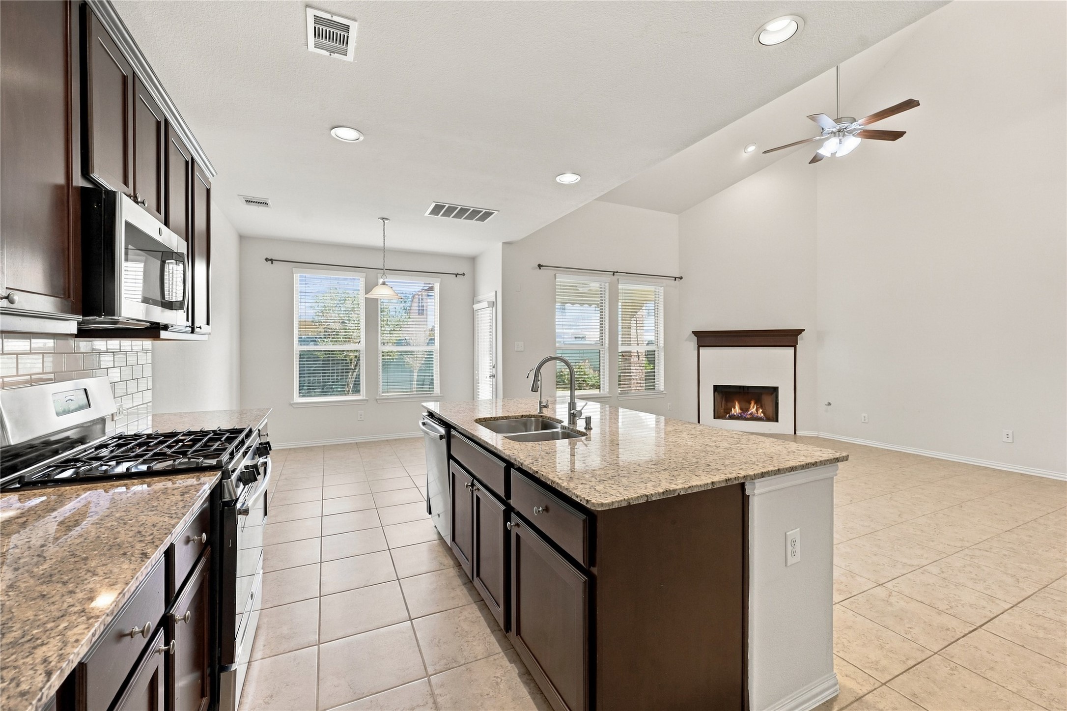 Stainless steel appliances, including a gas range, bring both style and functionality to the space!