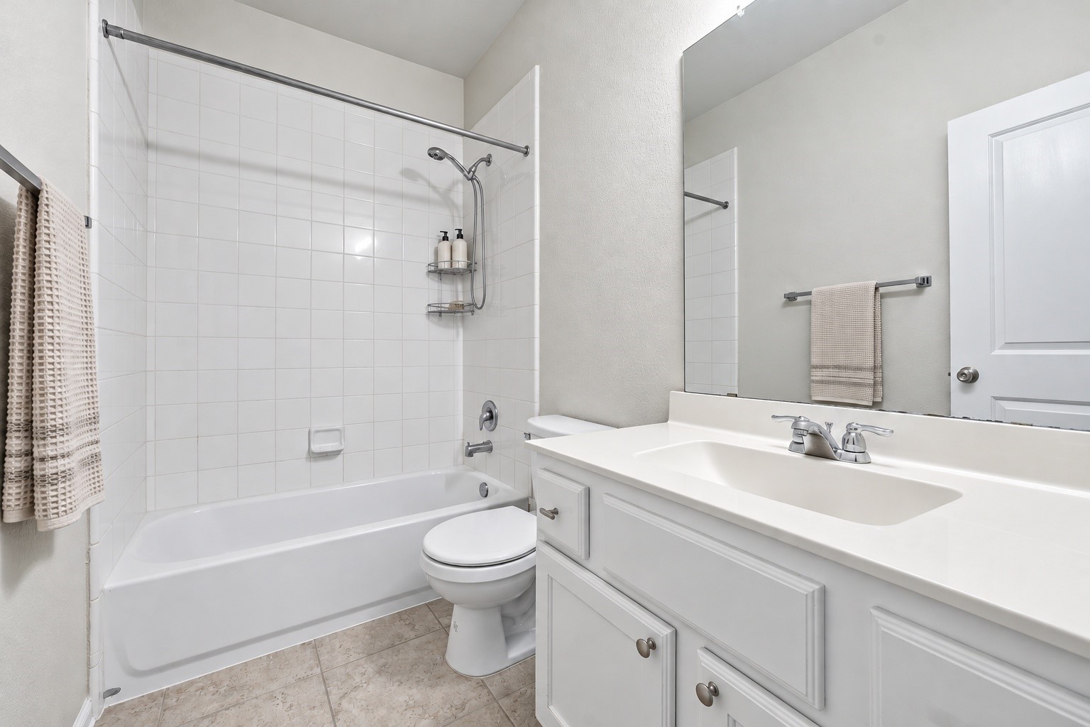 This convenient downstairs full bathroom features a clean, functional layout with a tub and shower combination, vanity storage, and neutral finishes!
*virtually staged*