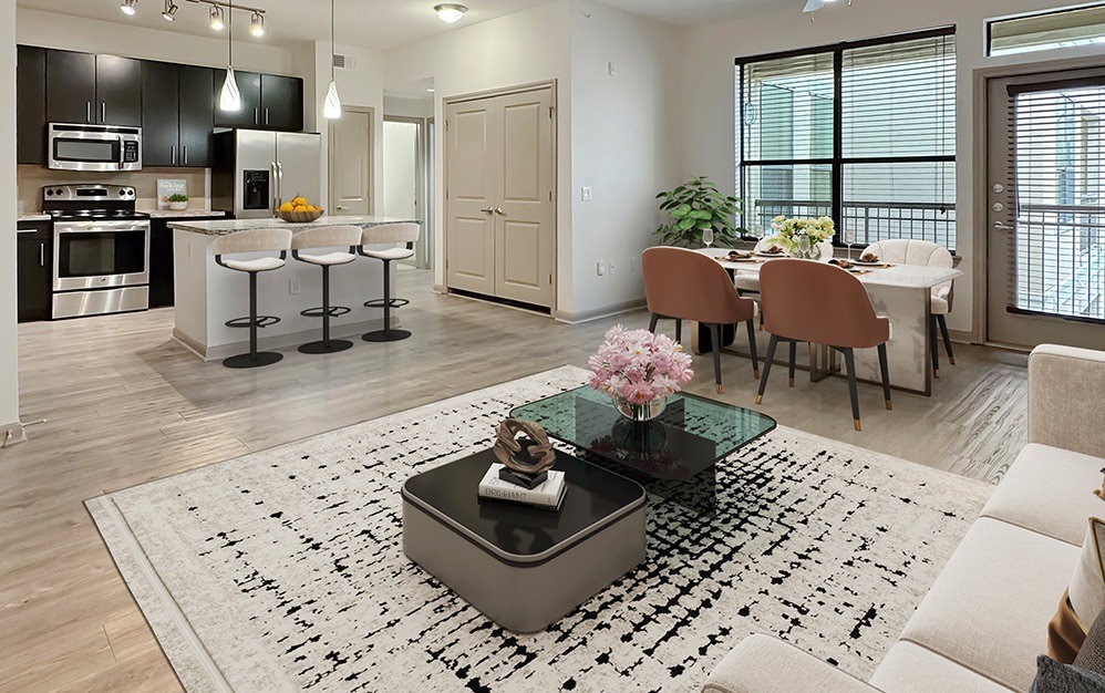 Sophisticated open concept living and dinning area with a sleek modern kitchen, abundant natural light and a spacious, inviting layout perfect for entertaining in style.