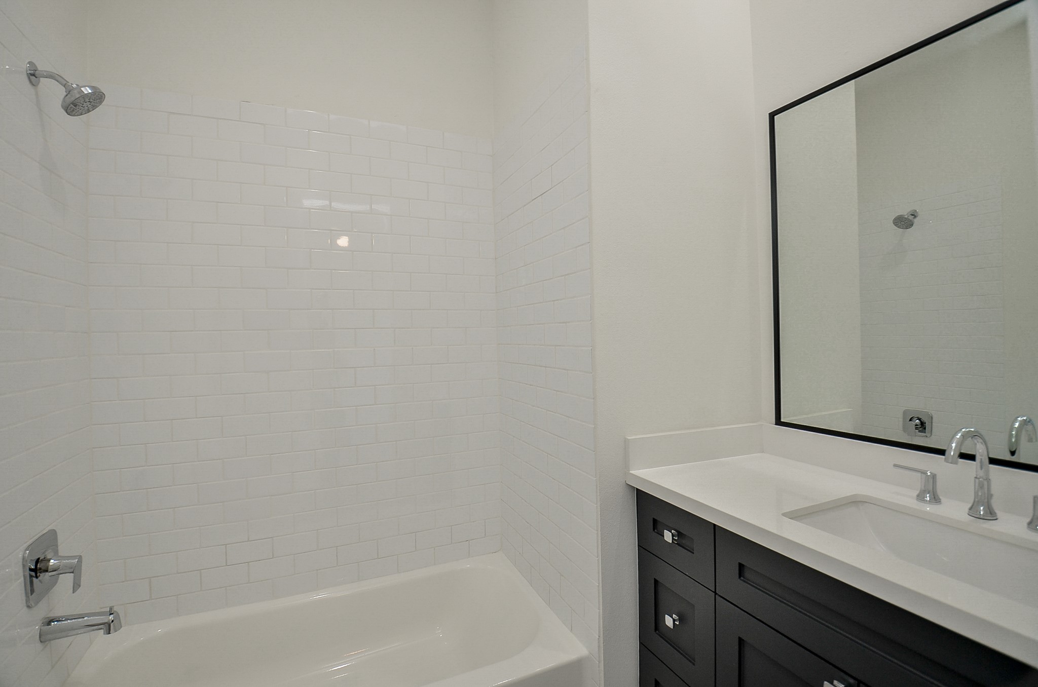 Private upstairs secondary bath with a tub and shower combination.