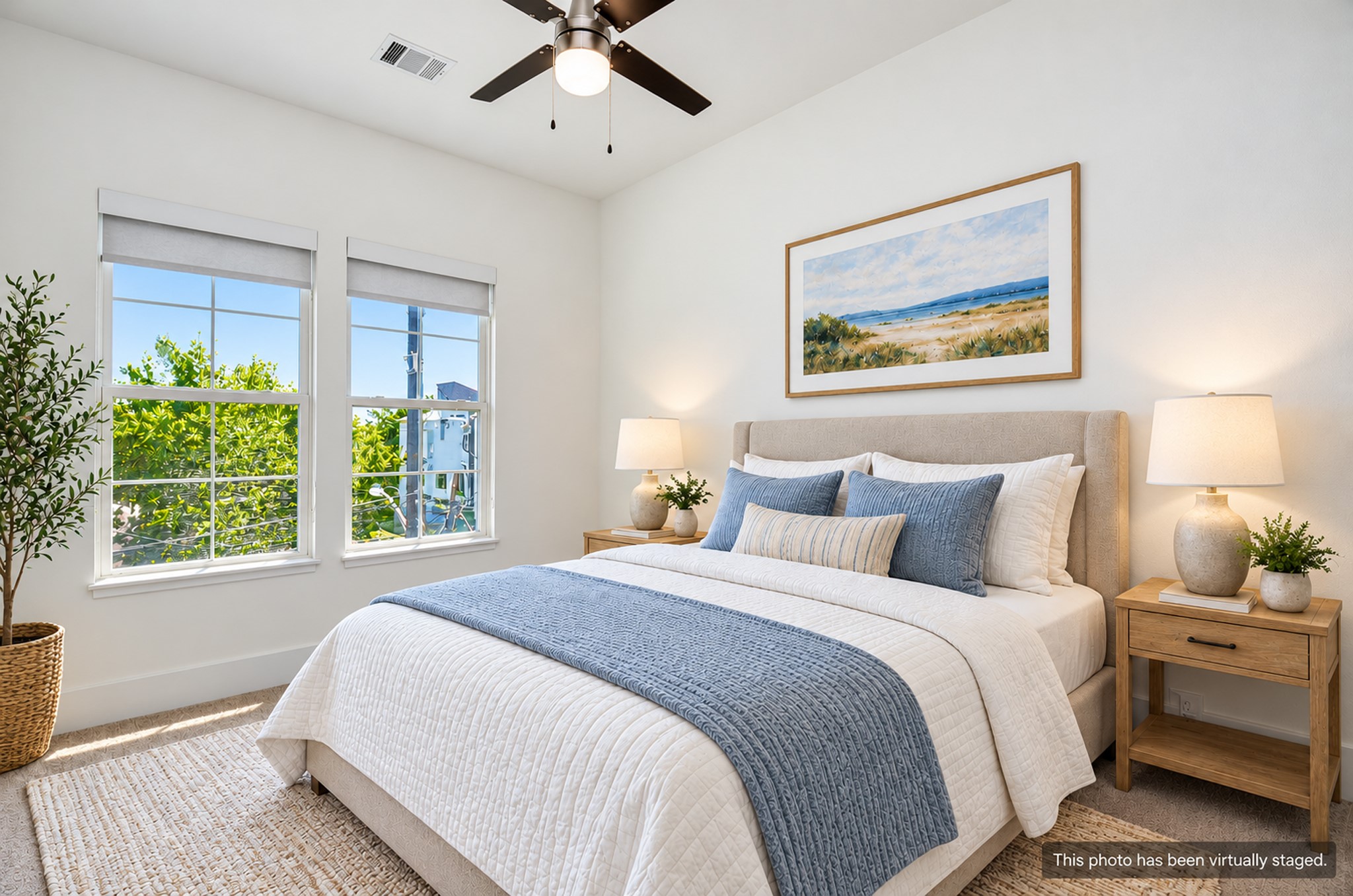 The second bedroom is located upstairs and has plush carpet and views of the side street.