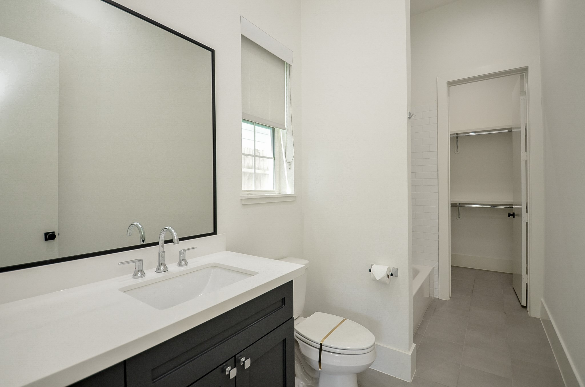 A full bath and walk-in closet serve the first-floor bedroom.