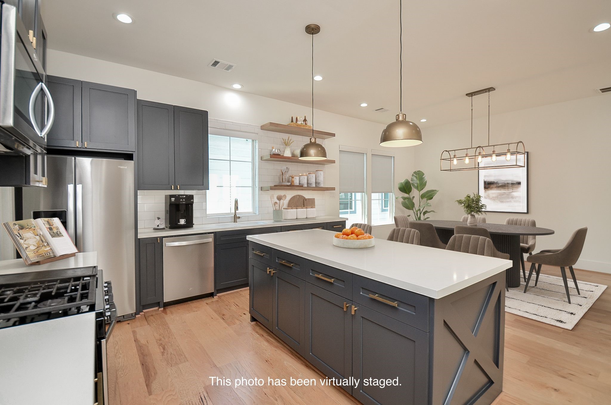 Kitchen storage combines cabinetry, open shelving, and an adjacent walk-in pantry.