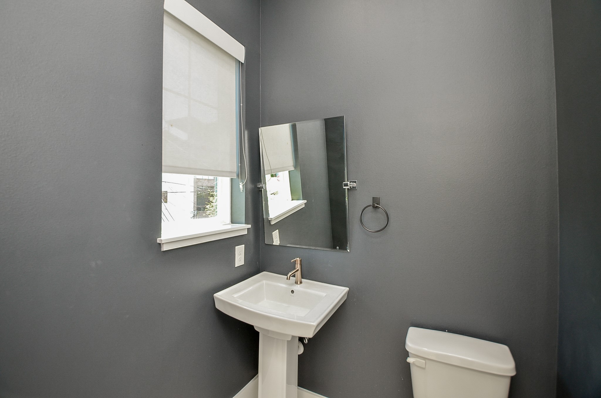 A second-floor half bath serves the main living and entertaining areas.