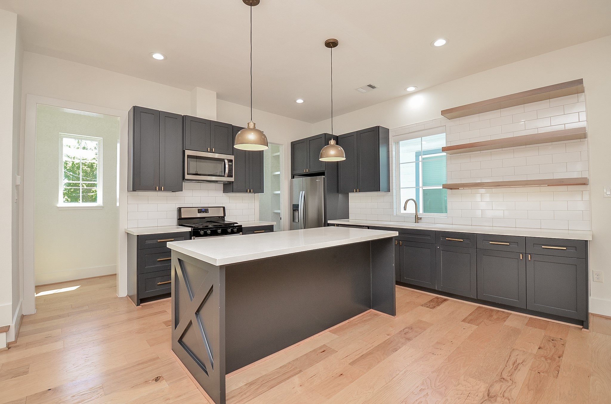The large island has space for bar stools and there's plenty of cabinetry for your storage needs.