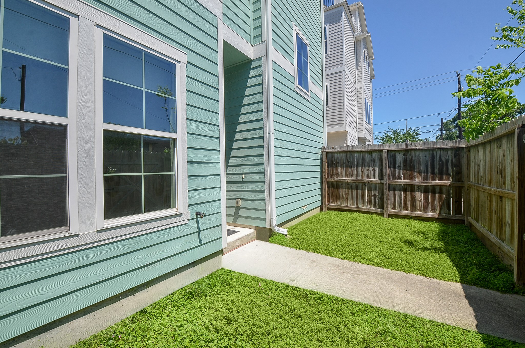A second view shows the fenced yards shape and usable outdoor space.