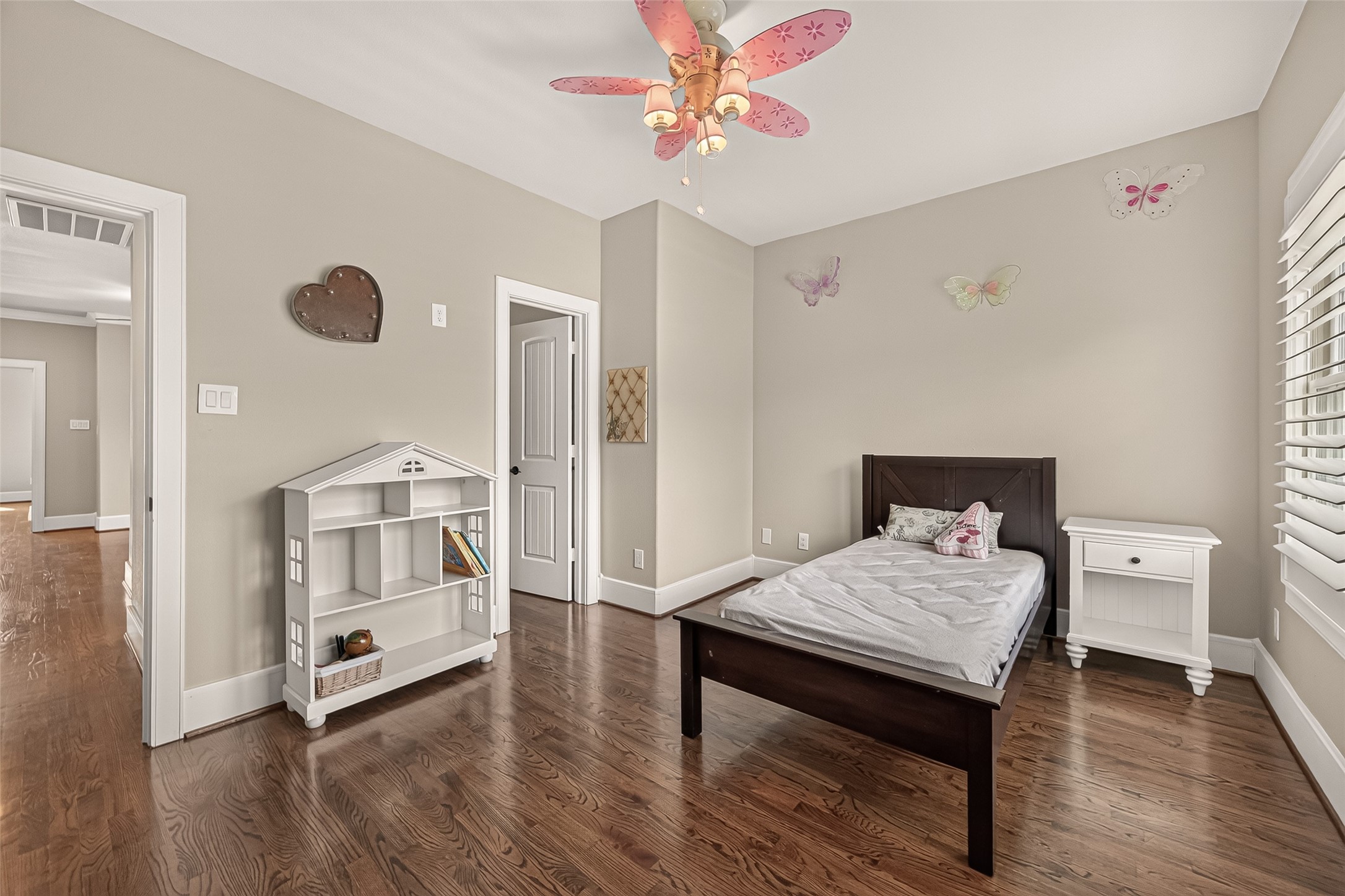 Secondary bedroom has a ceiling fan and big closet
