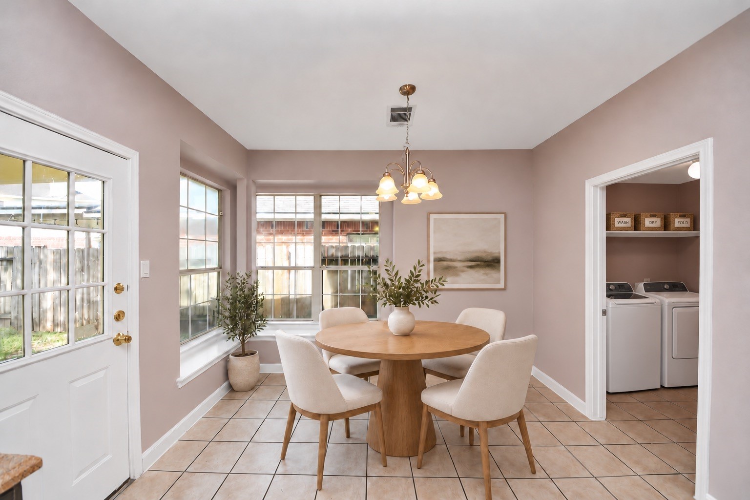 *Virtually staged breakfast area in the kitchen and the laundry room*