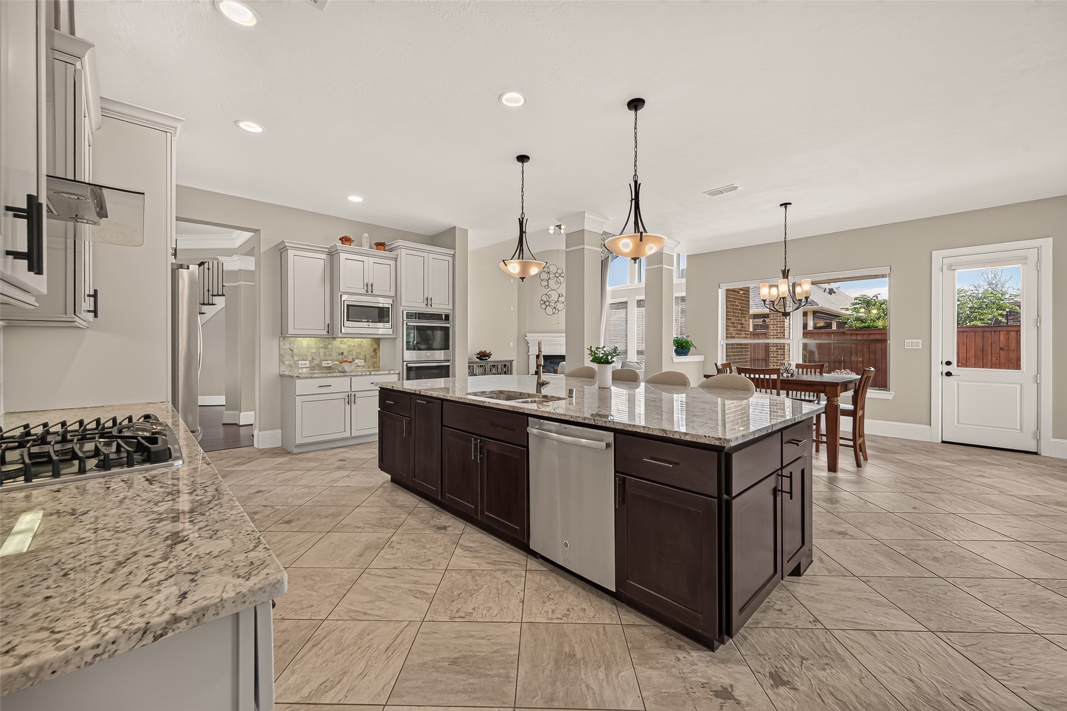 Amazing Chefs Kitchen with granite countertops, SS Appliances, Double Oven, Walk-In Pantry and Large Island overlooking Breakfast nook and Lake
