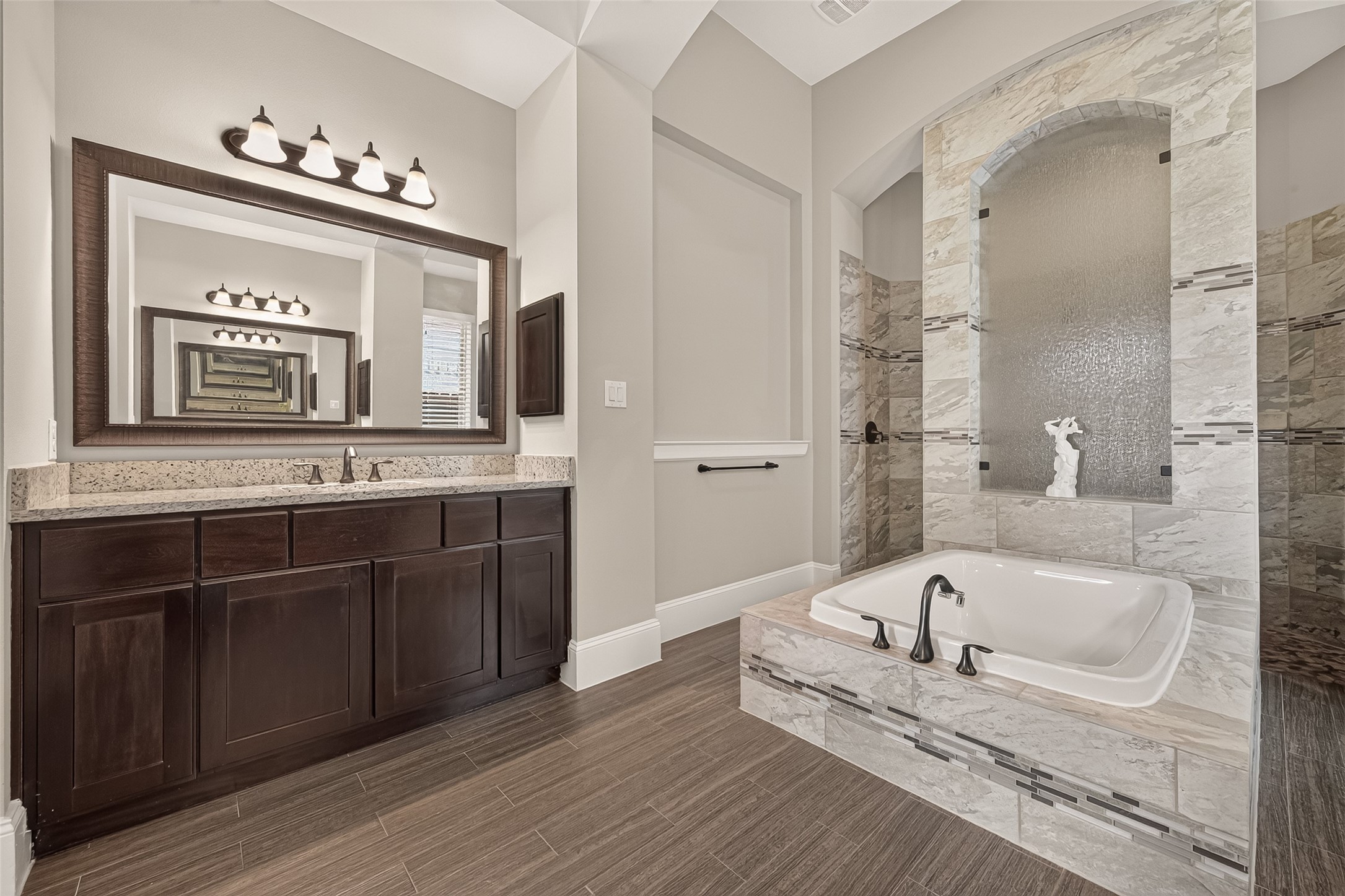 Grand Primary Bath with Large Soaking Tub and Walk In Texas Sized Shower