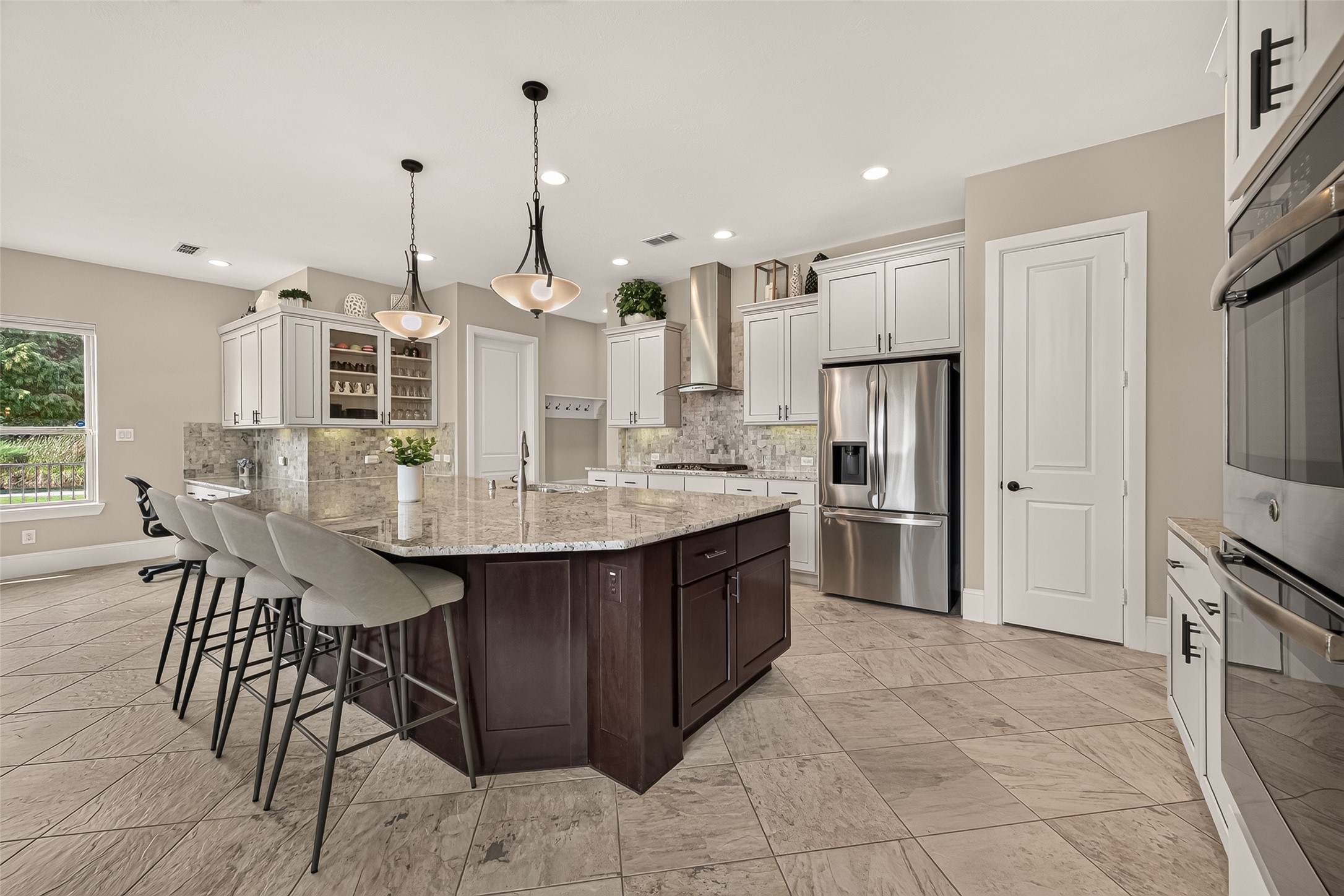 Amazing Chefs Kitchen with granite countertops, SS Appliances, Double Oven, Walk-In Pantry and Large Island overlooking Breakfast nook and Lake