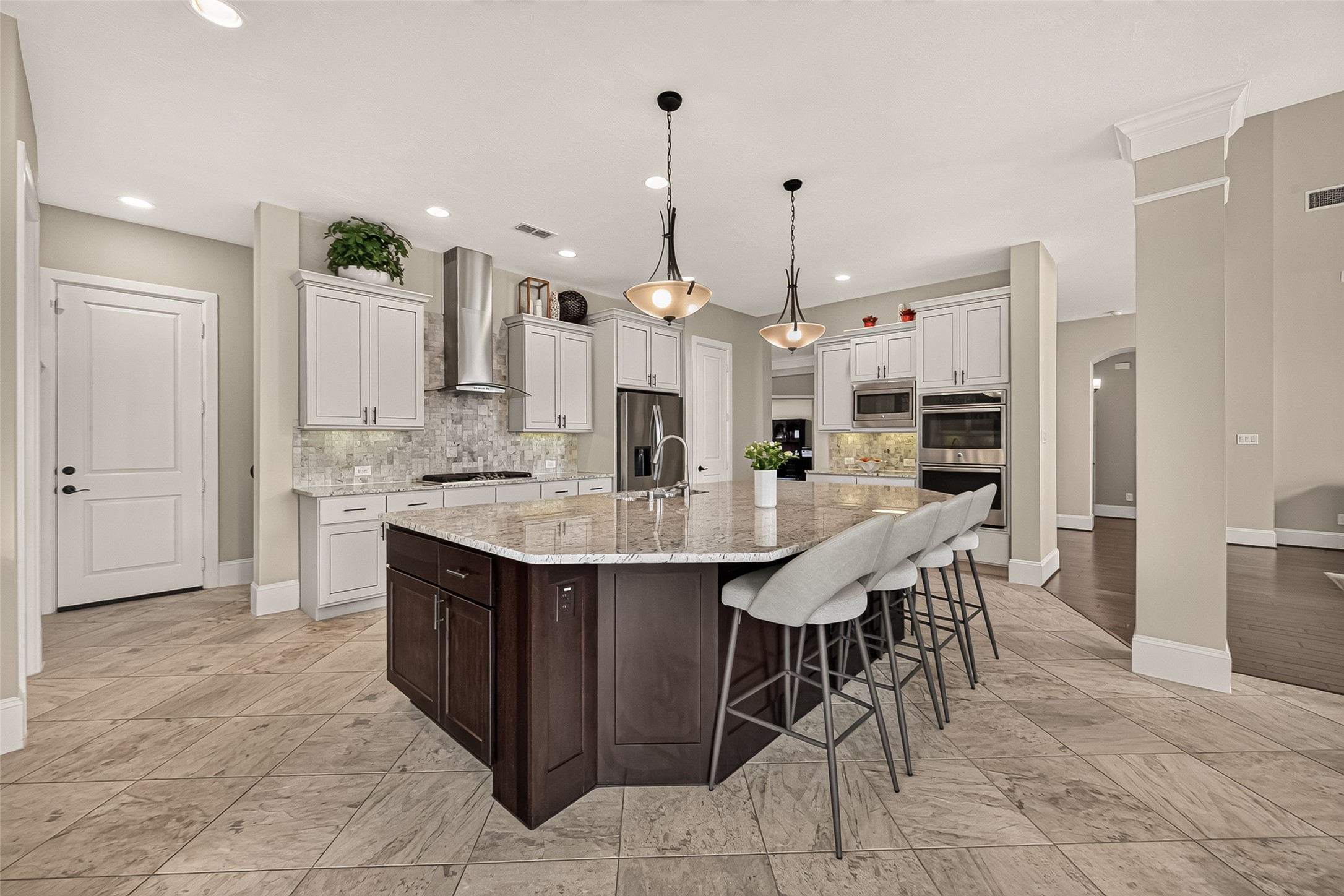 Amazing Chefs Kitchen with granite countertops, SS Appliances, Double Oven, Walk-In Pantry and Large Island overlooking Breakfast nook and Lake