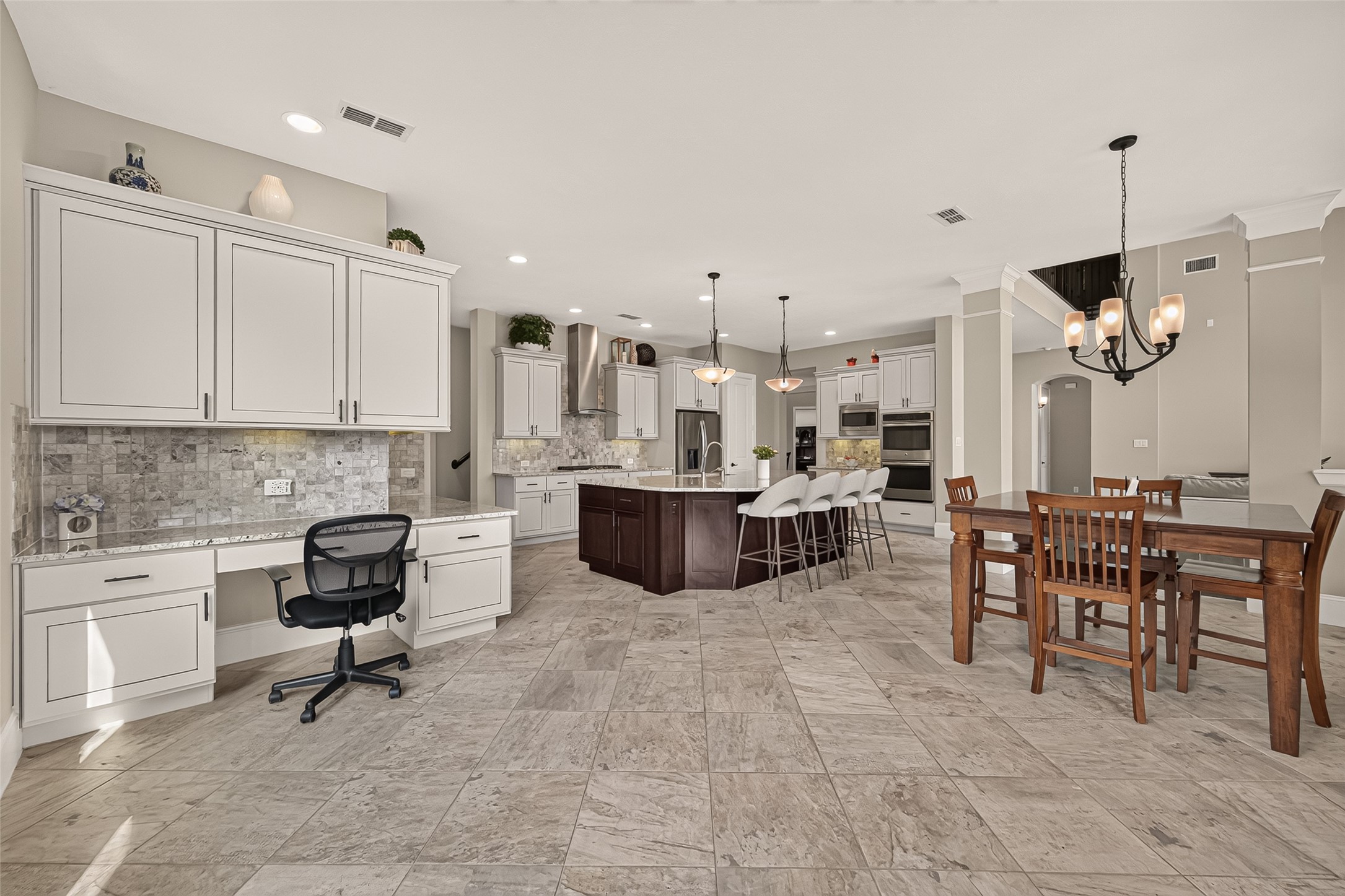 Amazing Chefs Kitchen with granite countertops, SS Appliances, Double Oven, Walk-In Pantry and Large Island overlooking Breakfast nook and Lake