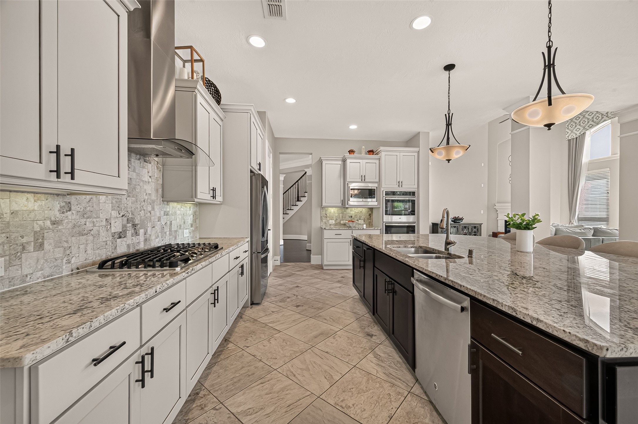 Amazing Chefs Kitchen with granite countertops, SS Appliances, Double Oven, Walk-In Pantry and Large Island overlooking Breakfast nook and Lake