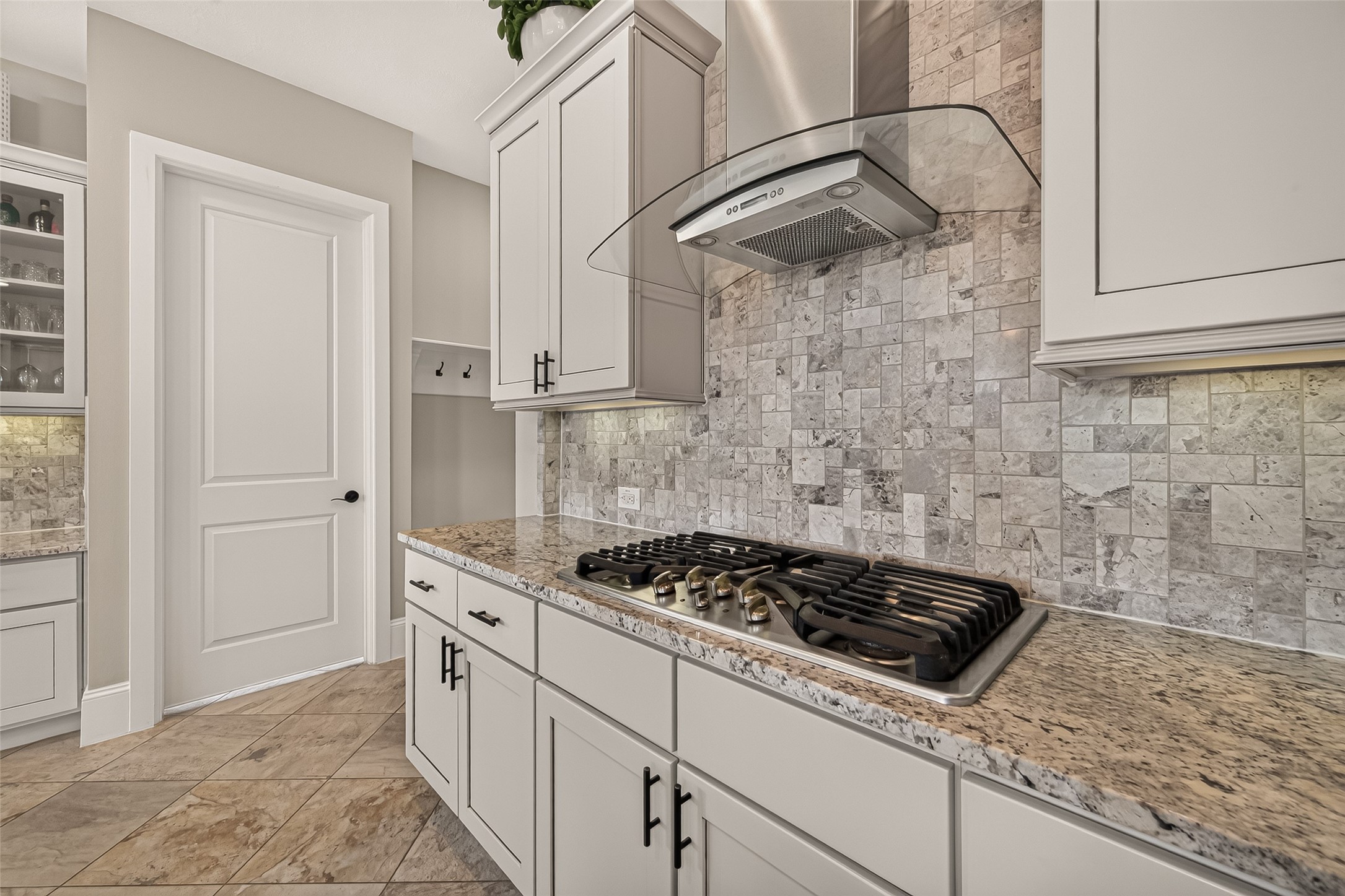 Amazing Chefs Kitchen with granite countertops, SS Appliances, Double Oven, Walk-In Pantry and Large Island overlooking Breakfast nook and Lake