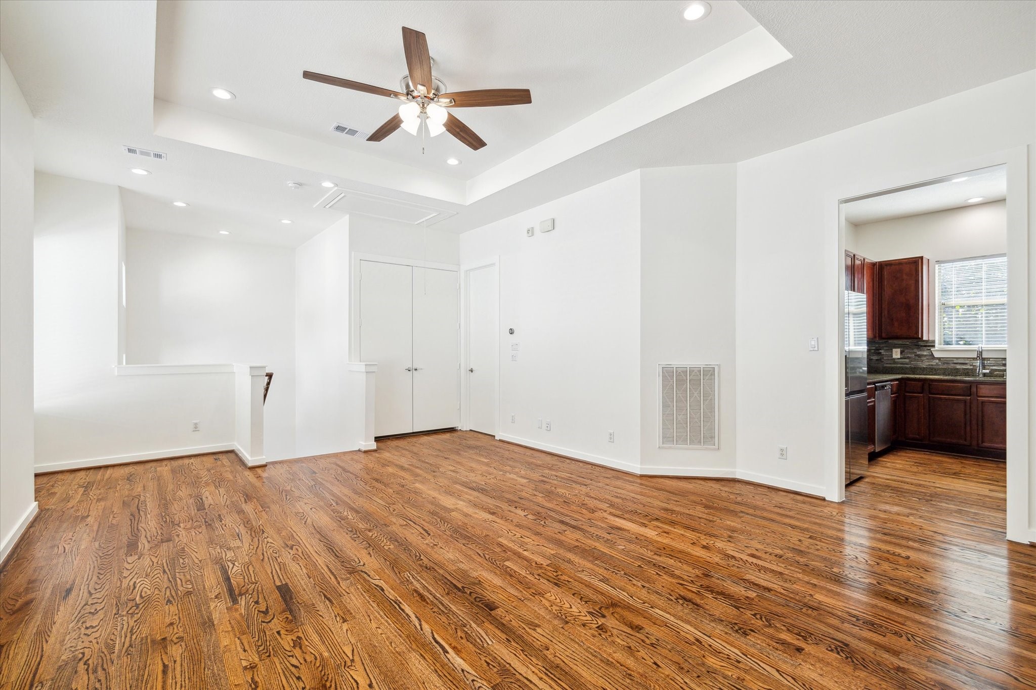 Another view of the living area and a glimpse into the kitchen.