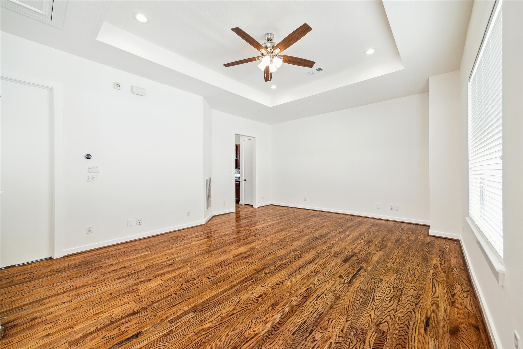 Another view of the living area-notice all the natural light from the huge window, plus ample, new LED recessed lights throughout.