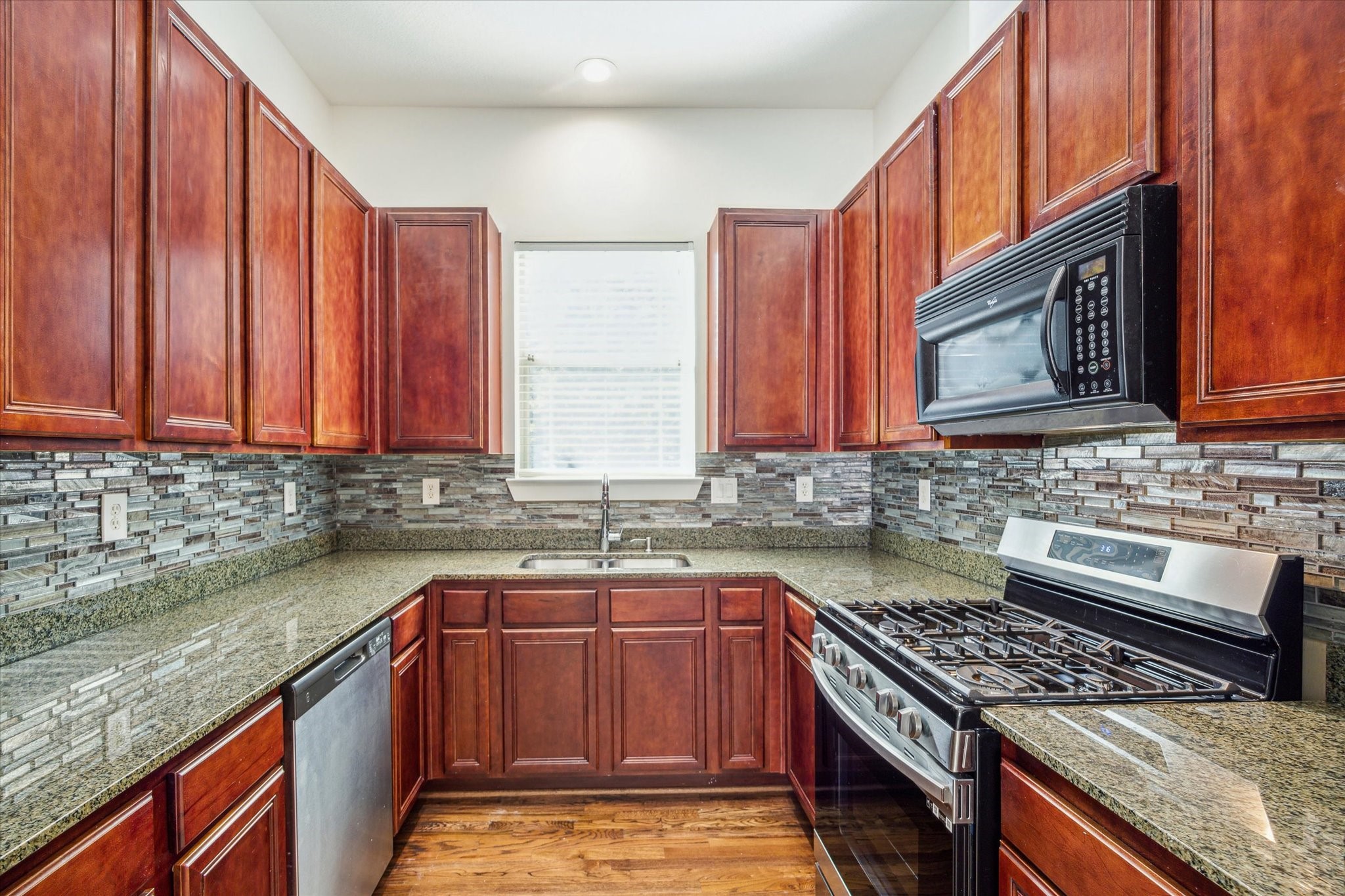 Great kitchen with gas cooking, plenty of storage and updated refrigerator and pantry (not shown in this photo).