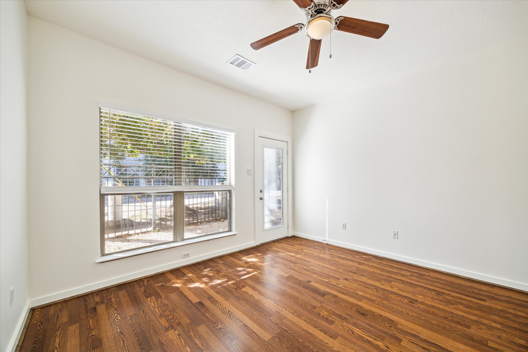 First floor bedroom with recently installed laminate flooring.