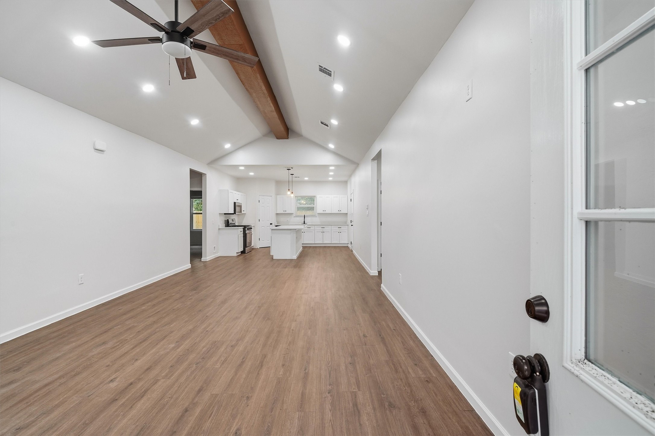 Like new! Fresh paint, modern flooring and exposed beam