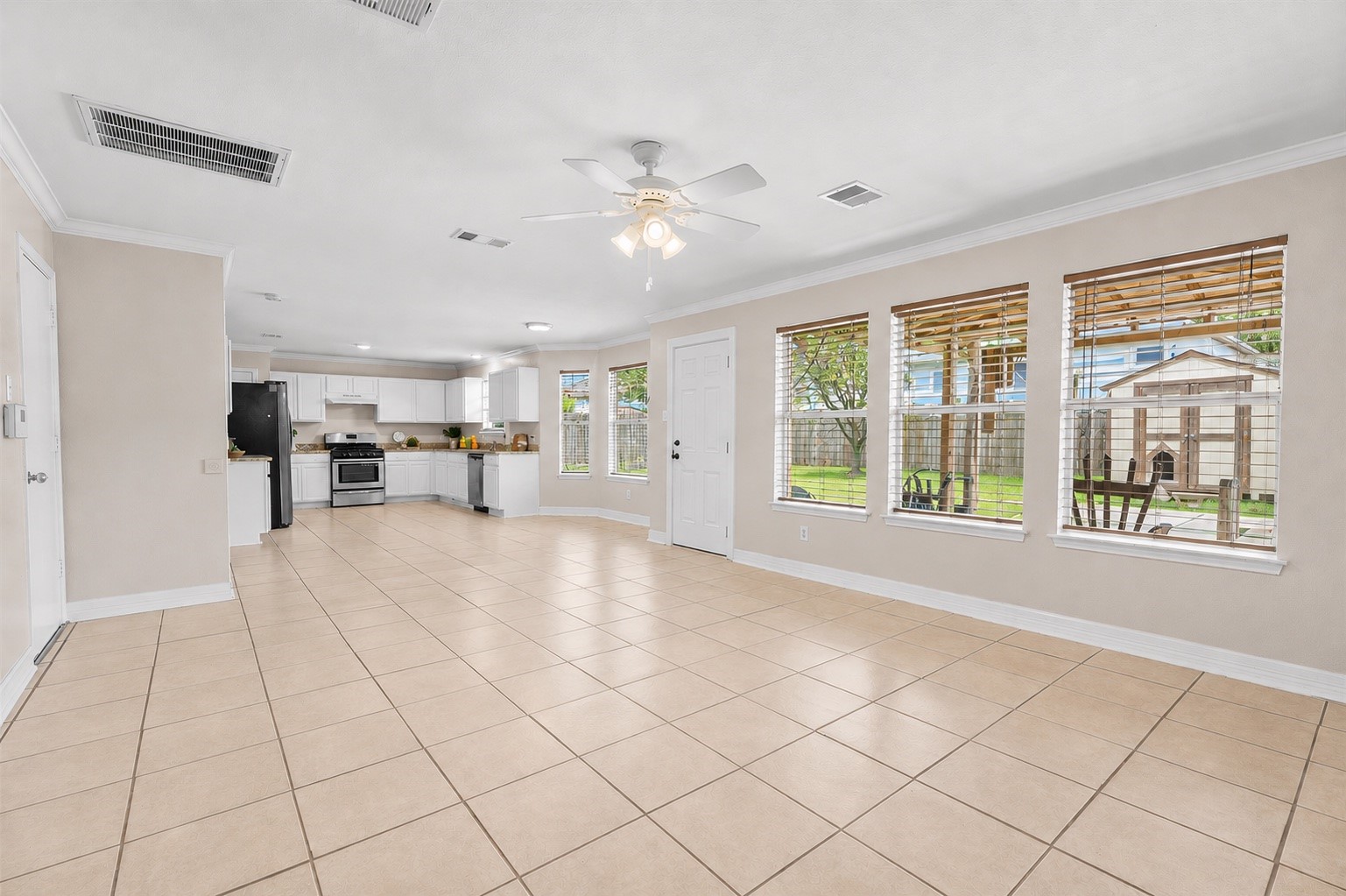 Spacious open-concept layout featuring a generous family room that flows effortlessly into the kitchen and breakfast area.