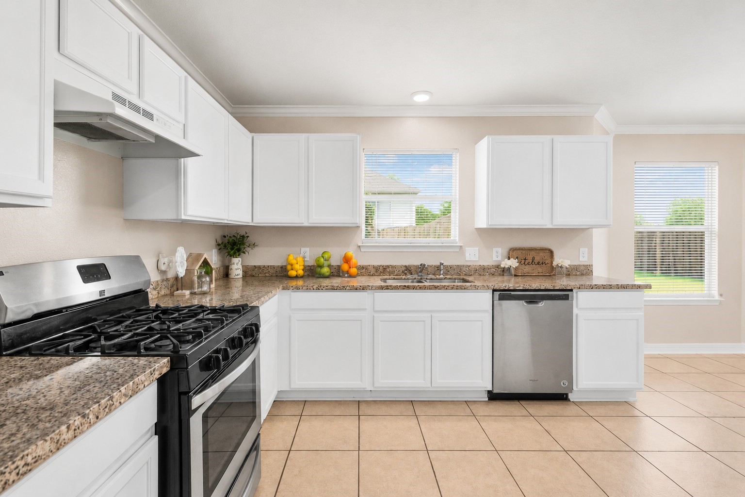 Enjoy plenty of prep space and natural light in this well-appointed kitchen designed for both functionality and convenience.