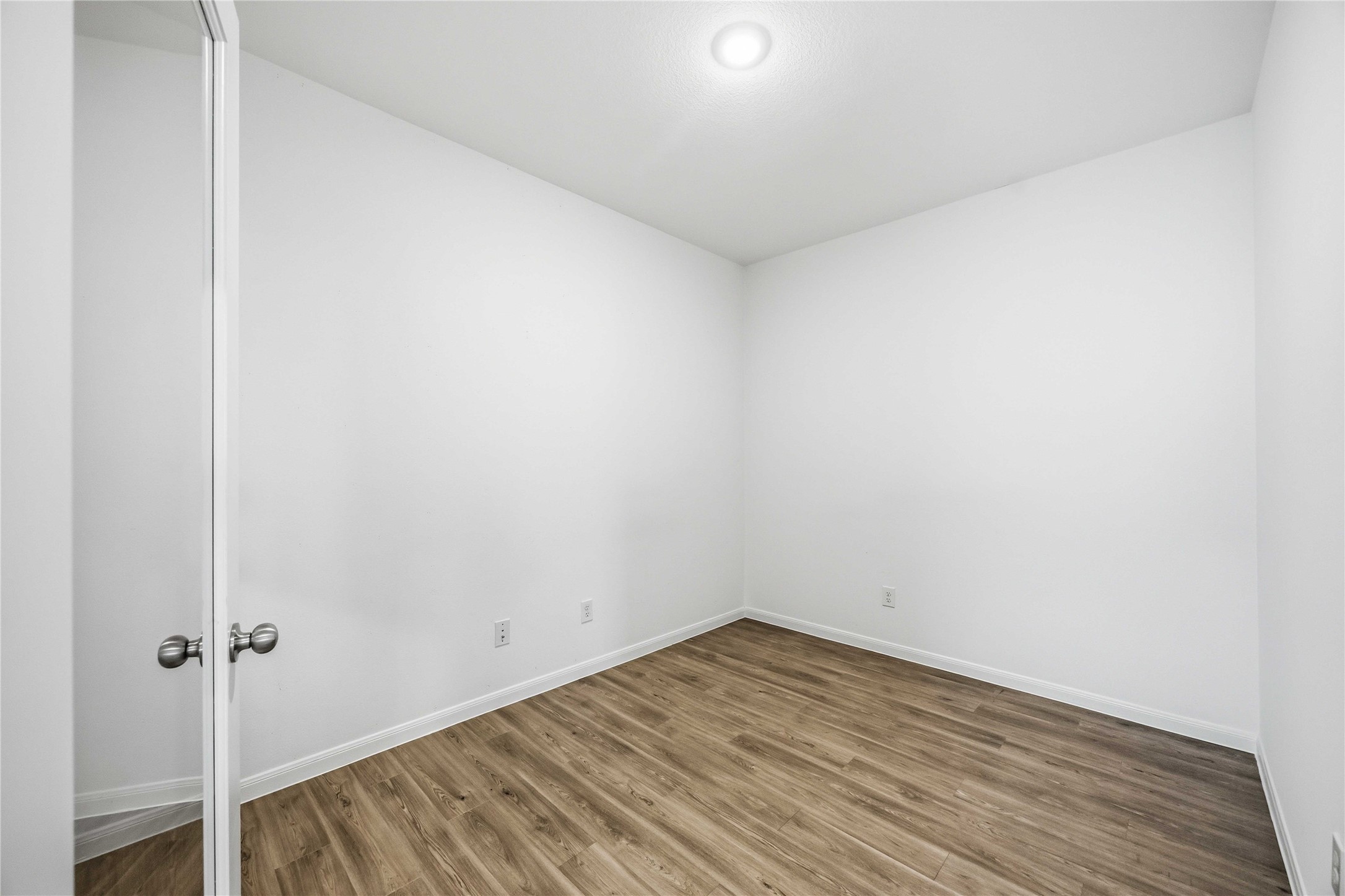 Dedicated home office with wood-look flooring.