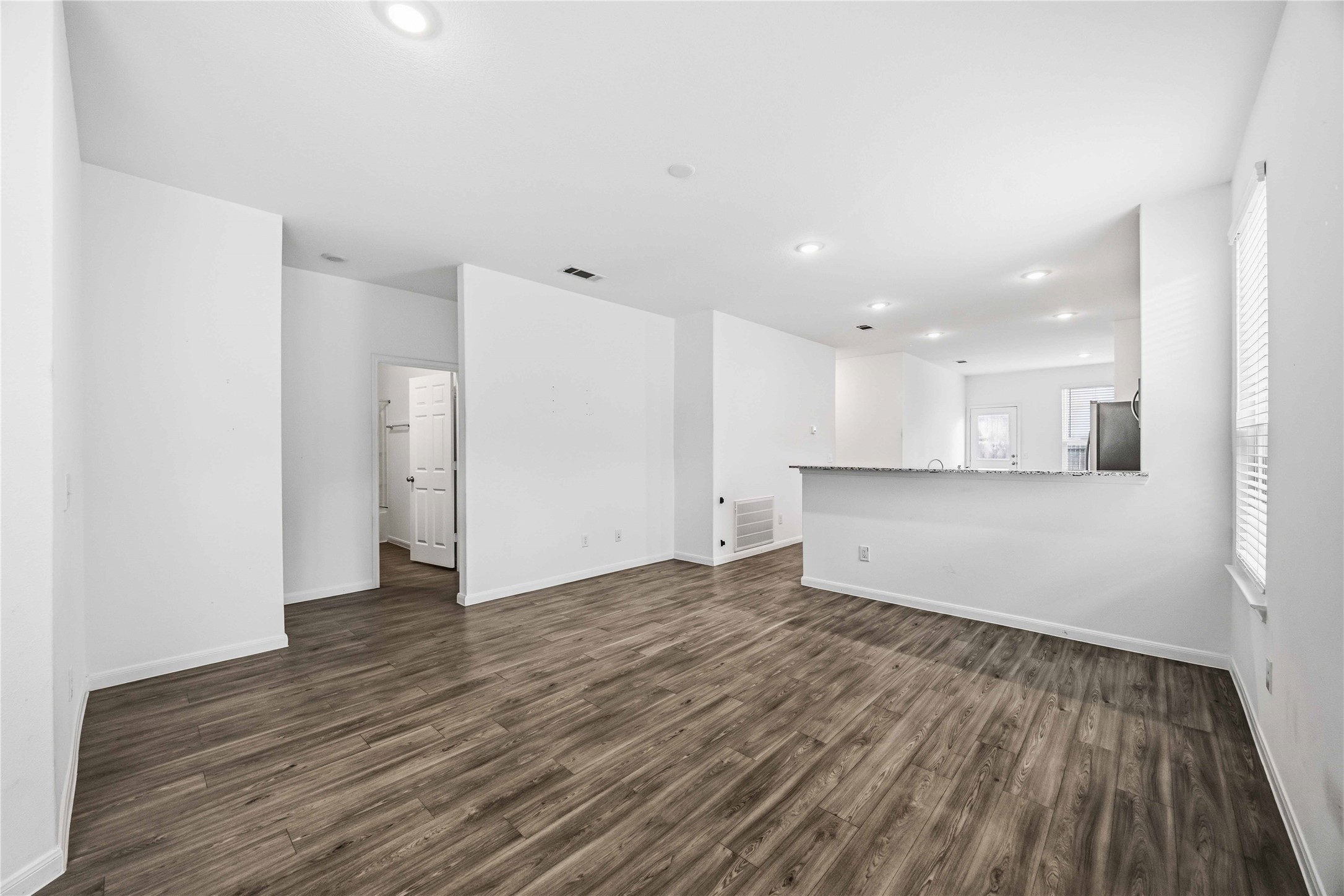 Open living area with views into the kitchen.