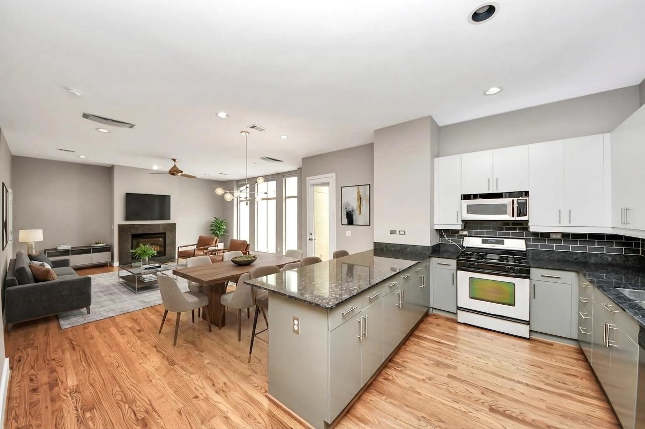 **Virtually staged open-concept living and dining room located on the second floor.