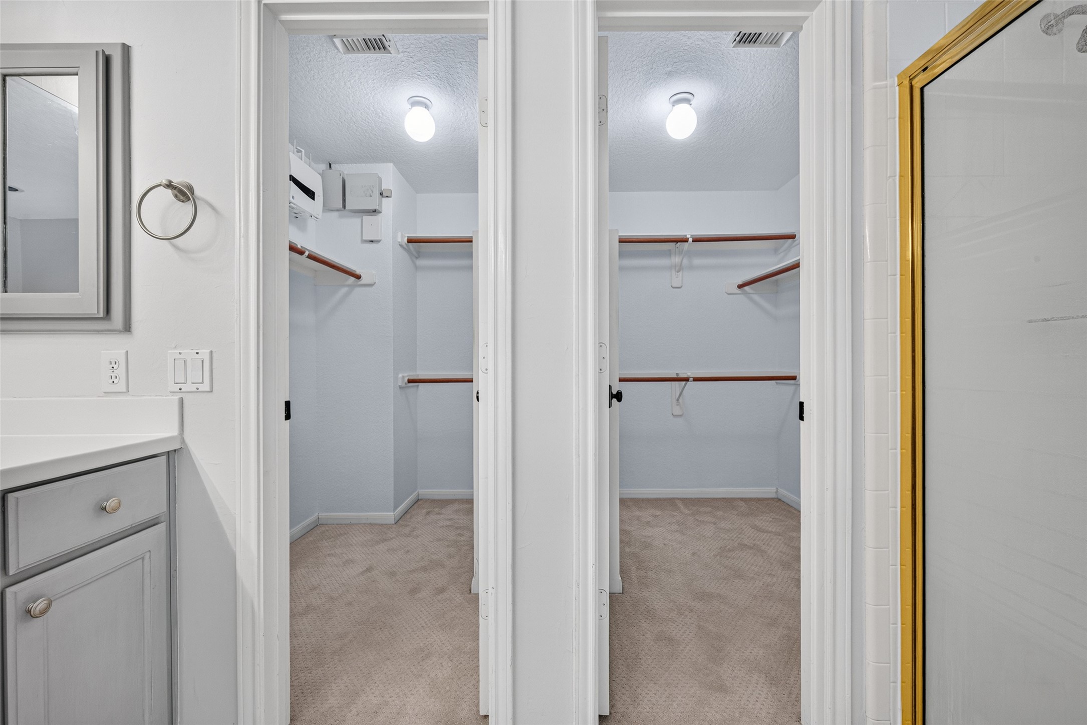 TWO WALK-IN CLOSETSDOUBLE THE POSSIBILITIES! The Primary Bath includes two separate walk-in closets, each with hanging rods & shelving for organizing clothing, shoes & accessories. Having individual closet spaces makes it easier to keep wardrobes organized, with room for everyday essentials as well as seasonal clothing. A practical convenience that adds to the comfort & functionality of the upstairs Primary Suite.
