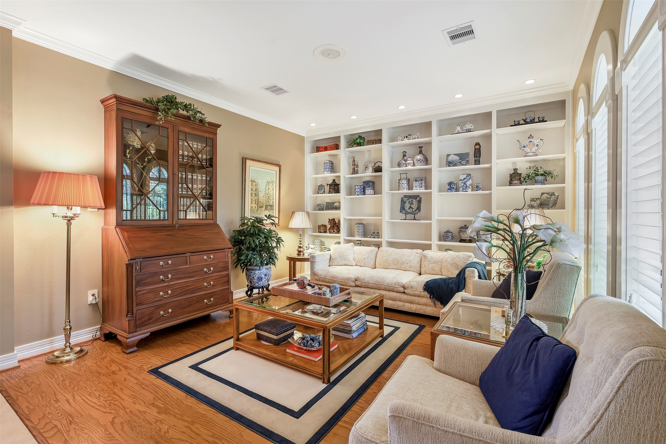 View from front door and foyer showcasing this area as a living room but can be a music room, library or study.