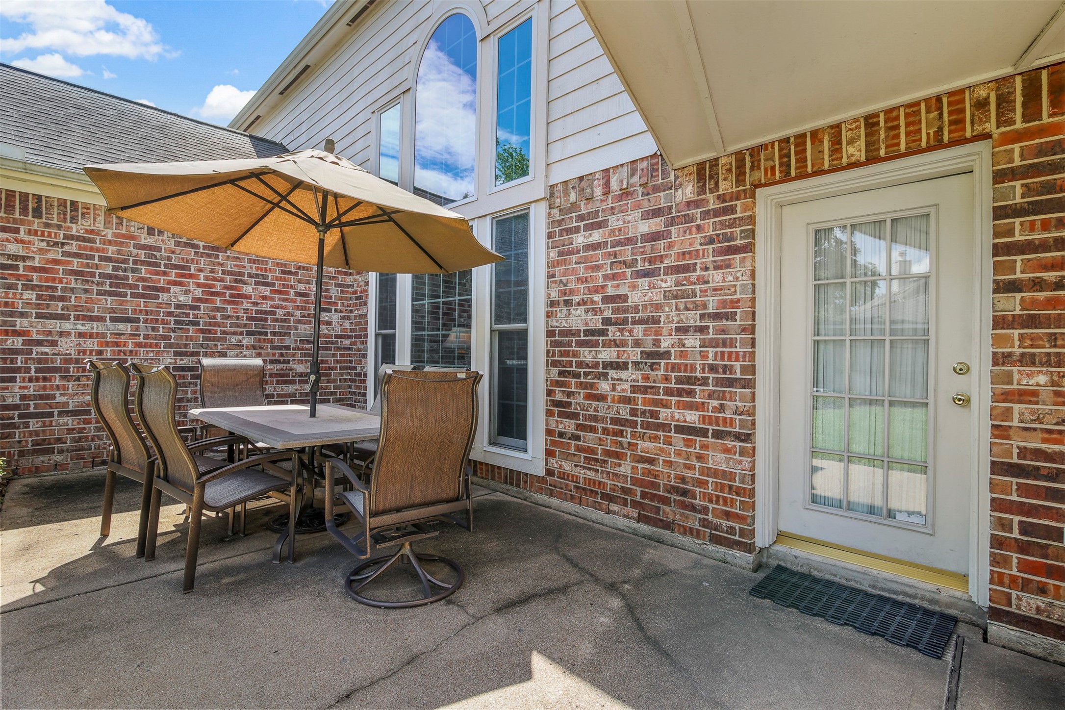 Backyard has a spacious patio area perfect for outdoor entertaining.
