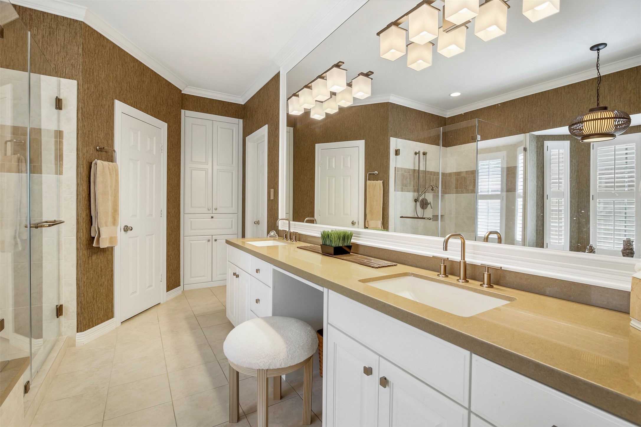 Primary bathroom has been updated to include quartz countertops with double sinks and knee space vanity area.