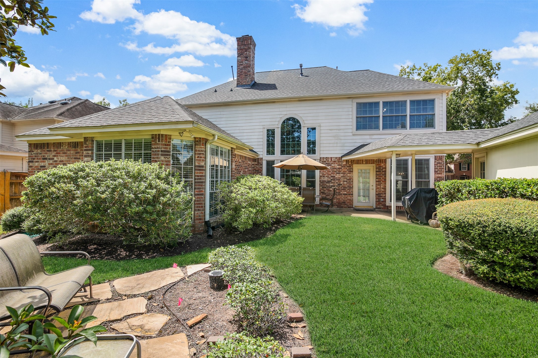 View of the back elevation of the home. *Grass has been virtually enhanced*