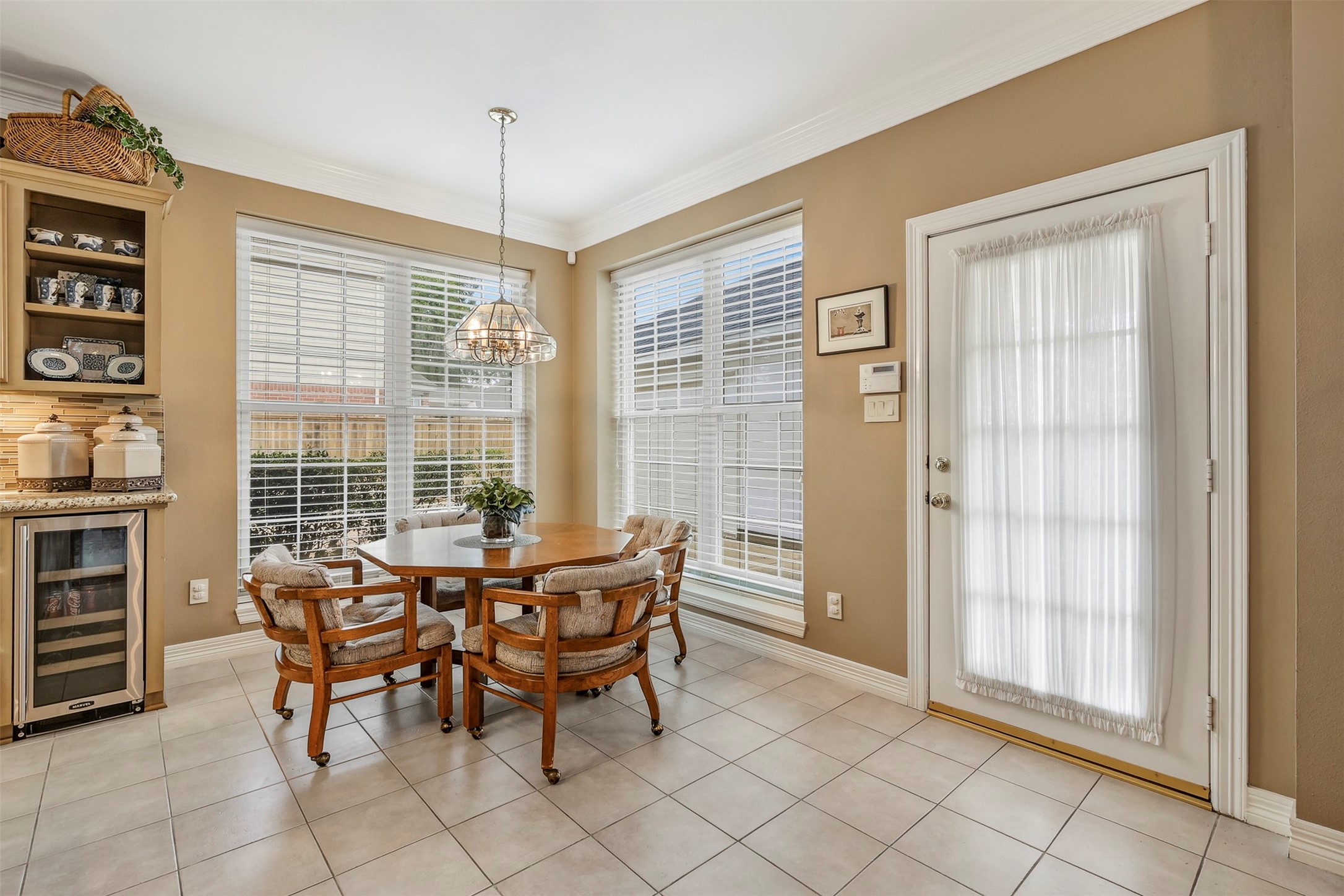 Breakfast room features large floor to ceiling picture windows for an abundance of natural light.