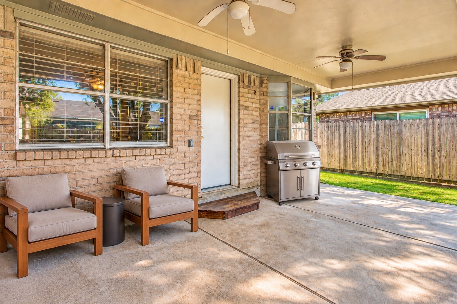 As you go through the back door, you are greeted with a huge covered back patio! *virtually staged*