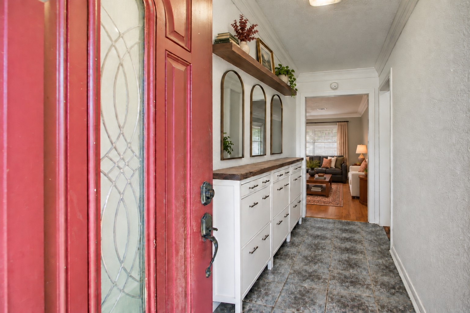As you enter, you are greeted with a long front entryway *virtually staged* As you enter, you are greeted with a long front entryway *virtually staged*