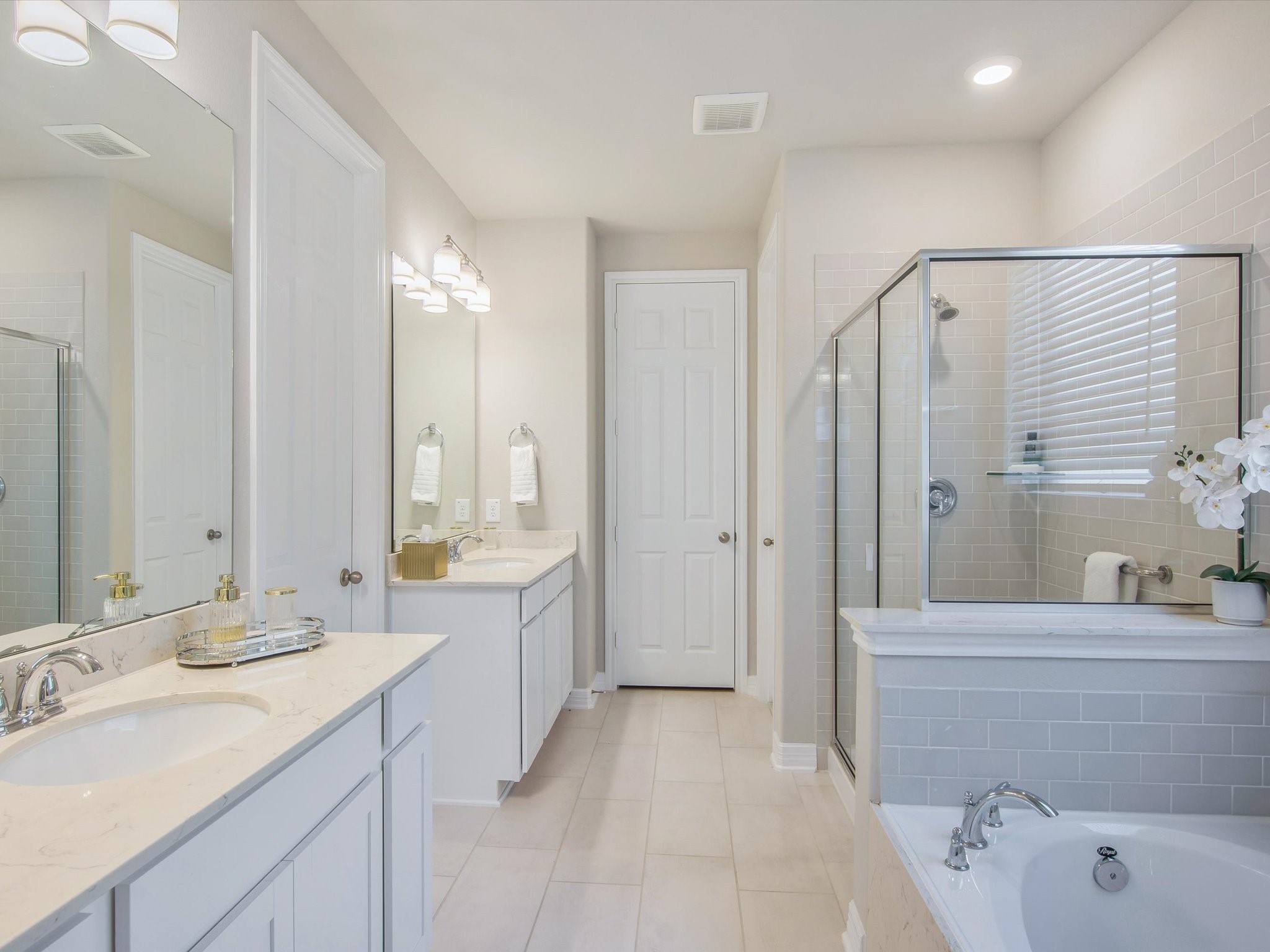 Double vanities, soaking tub and shower