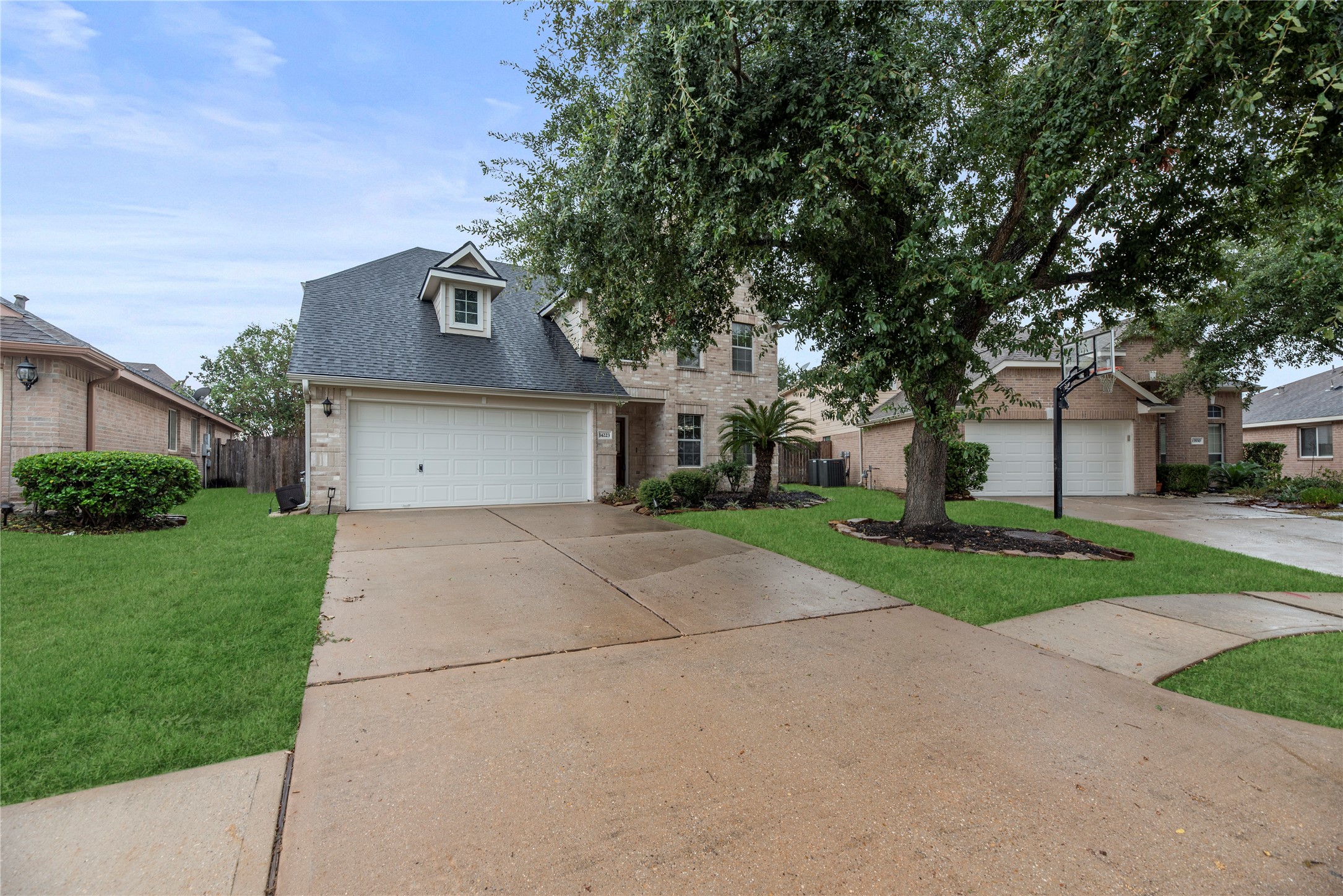 Lovely 2-story home with an attached 2-car garage and double-wide driveway.