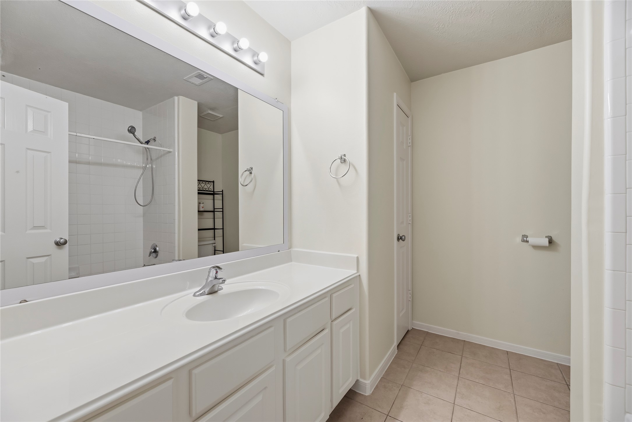 Full upstairs bathroom with a tub/shower combination.