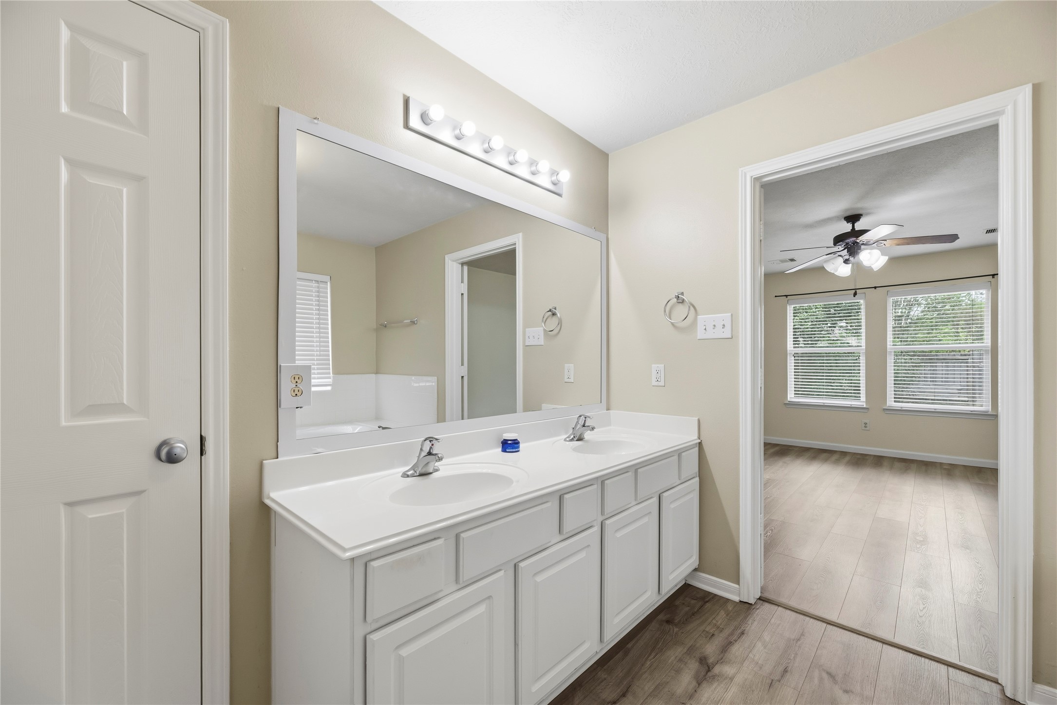 The primary bathroom includes a dual sink vanity.
