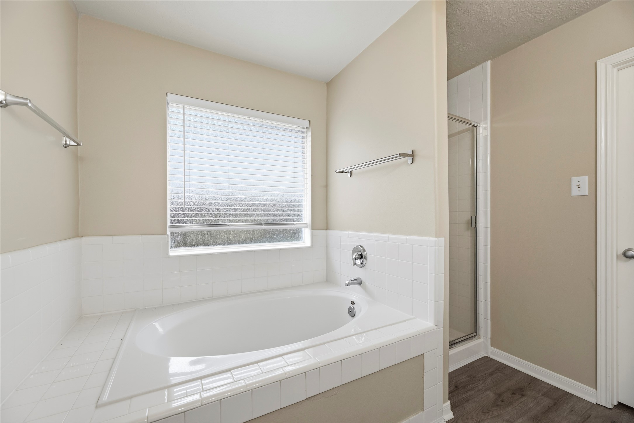 Soaking tub and separate shower.