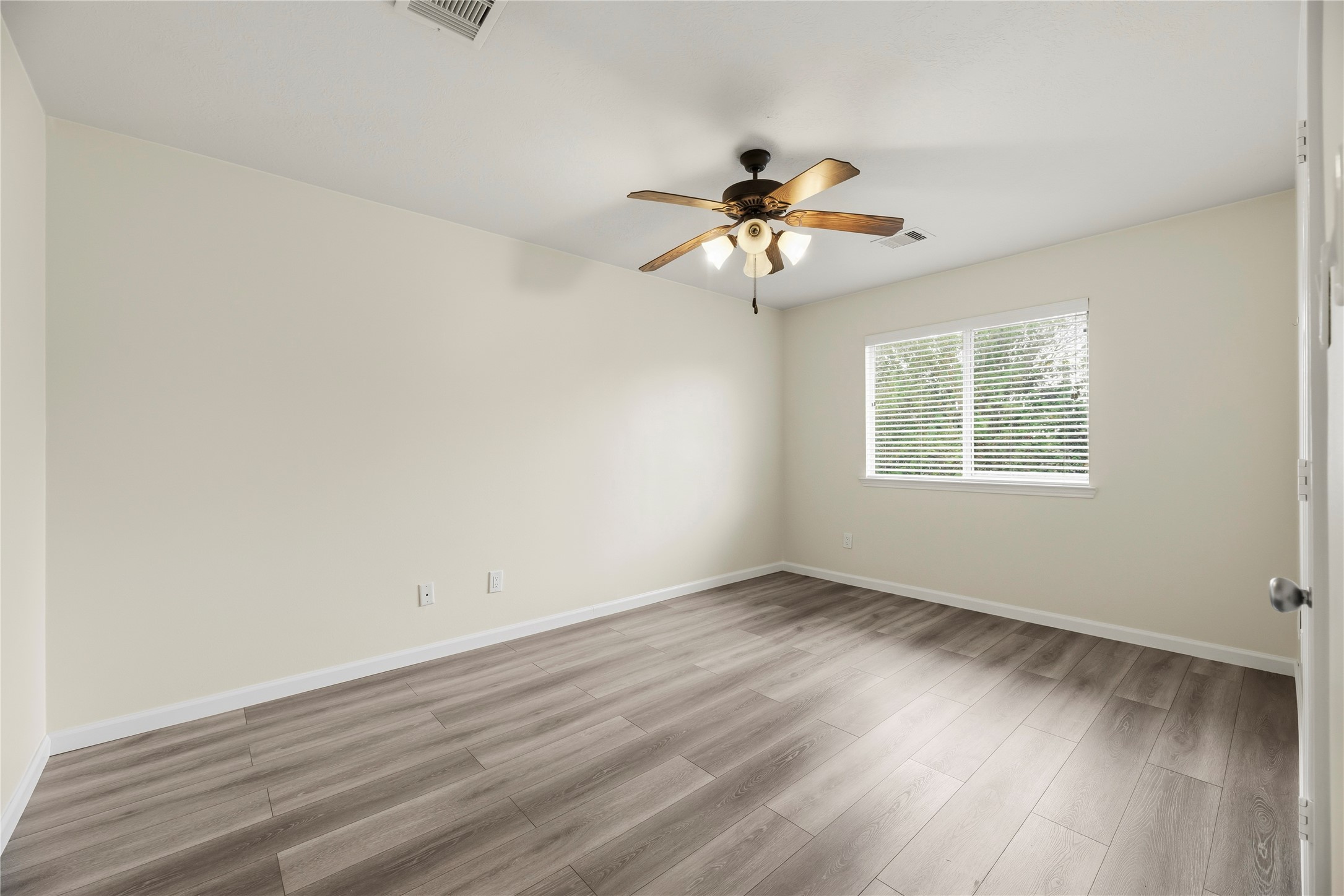 All upstairs bedrooms include LVP flooring, ceiling fans and large closets.
