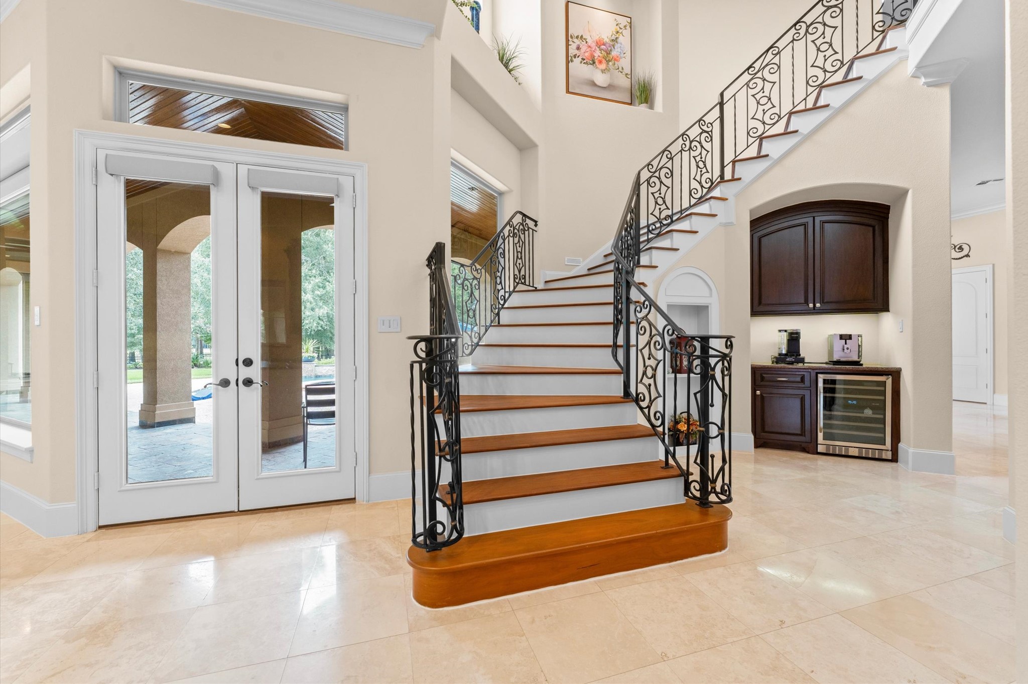 Grand staircase with beautiful wrought iron.