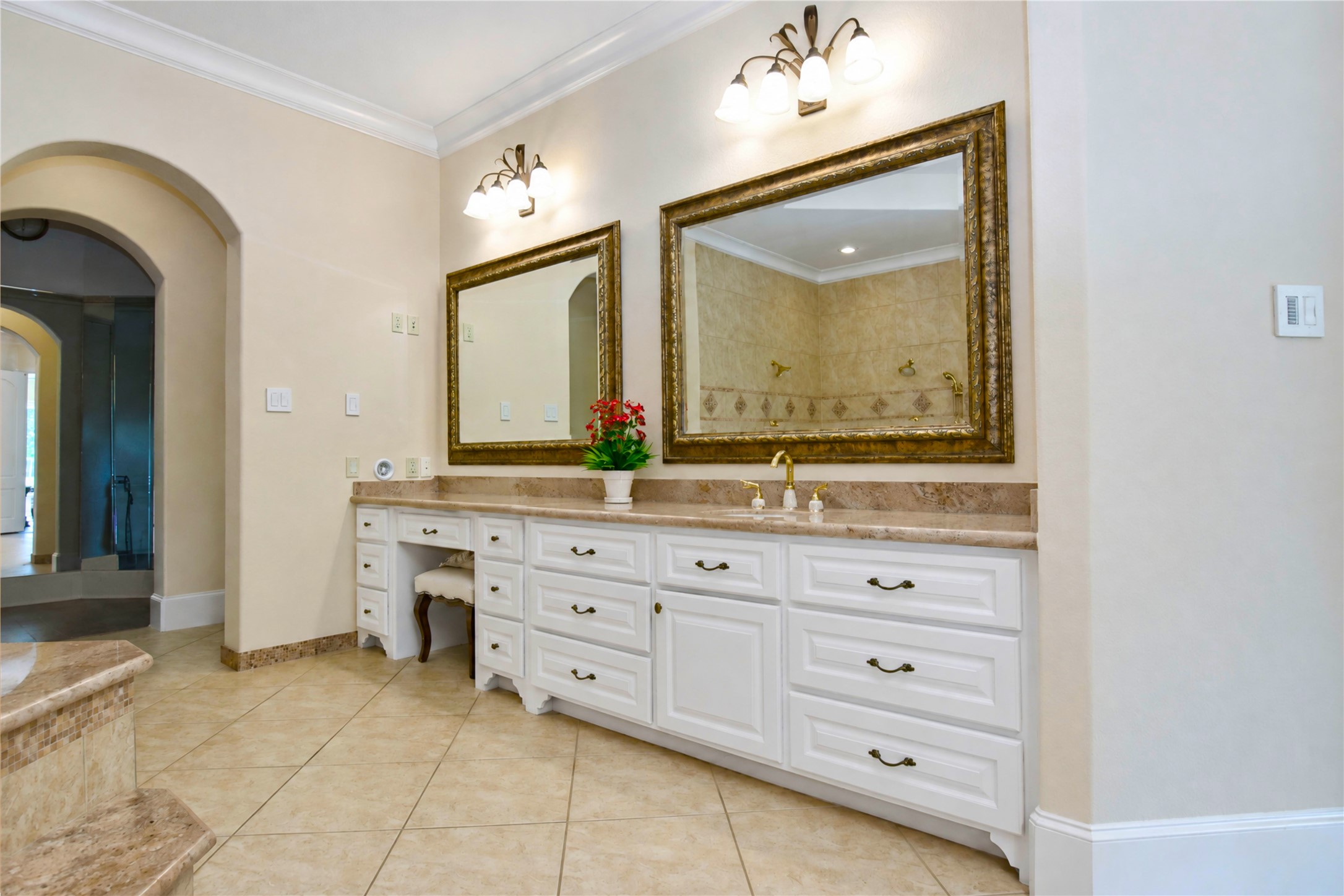 Primary vanity with closet door close by
