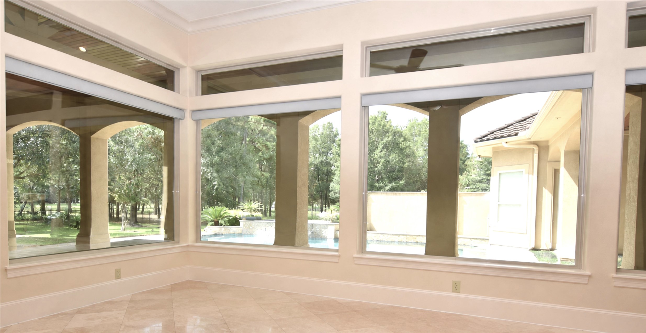 Living room overlooks the swimming pool and the lake.